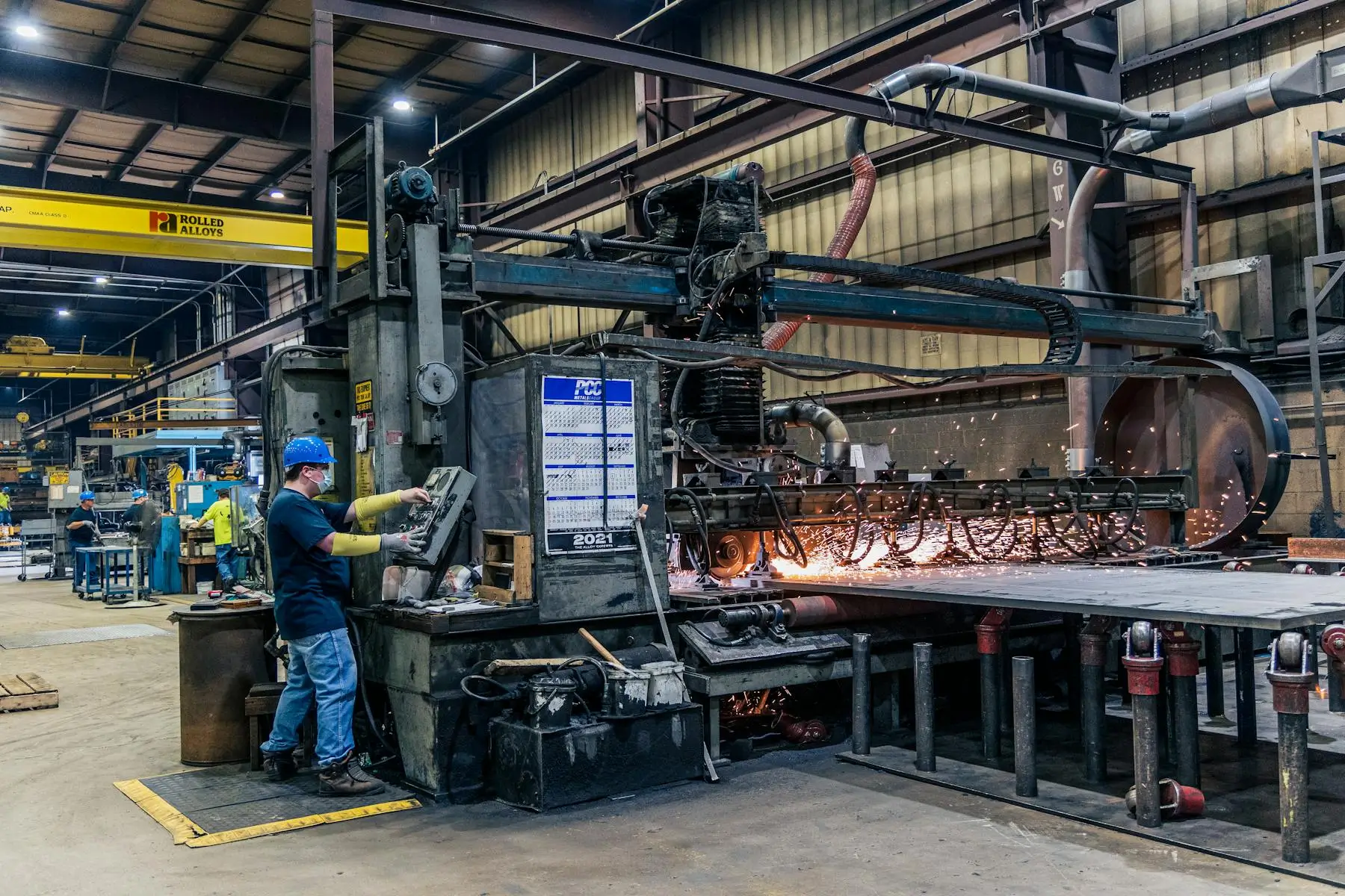 Factory worker and production machinery